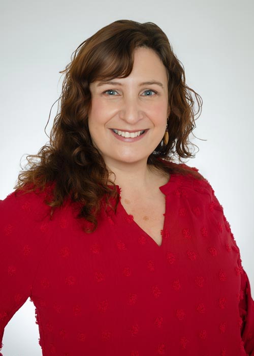 Smiling woman in red shirt