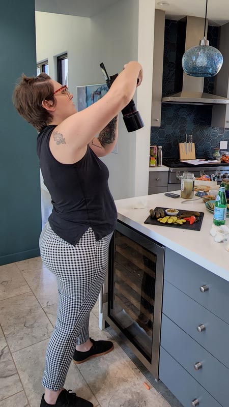 Person photographs food preparation