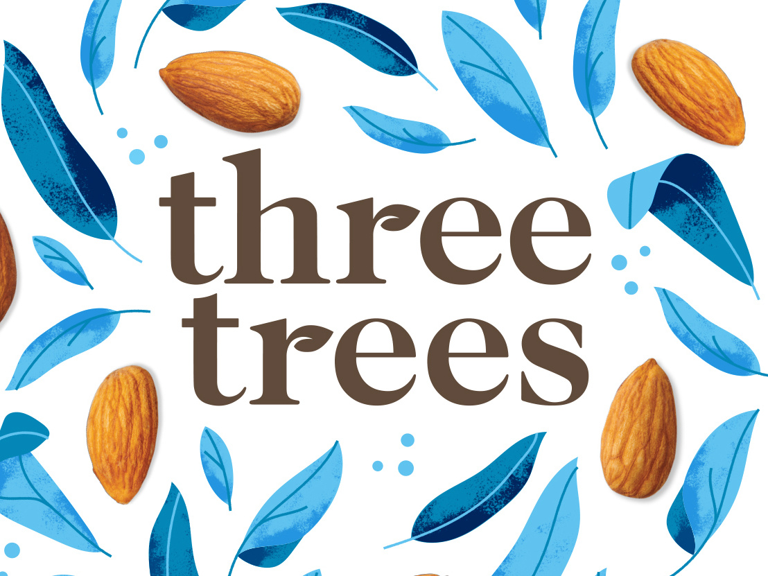 The words “three trees” appear in brown text surrounded by blue leaves and whole almonds on a white background.